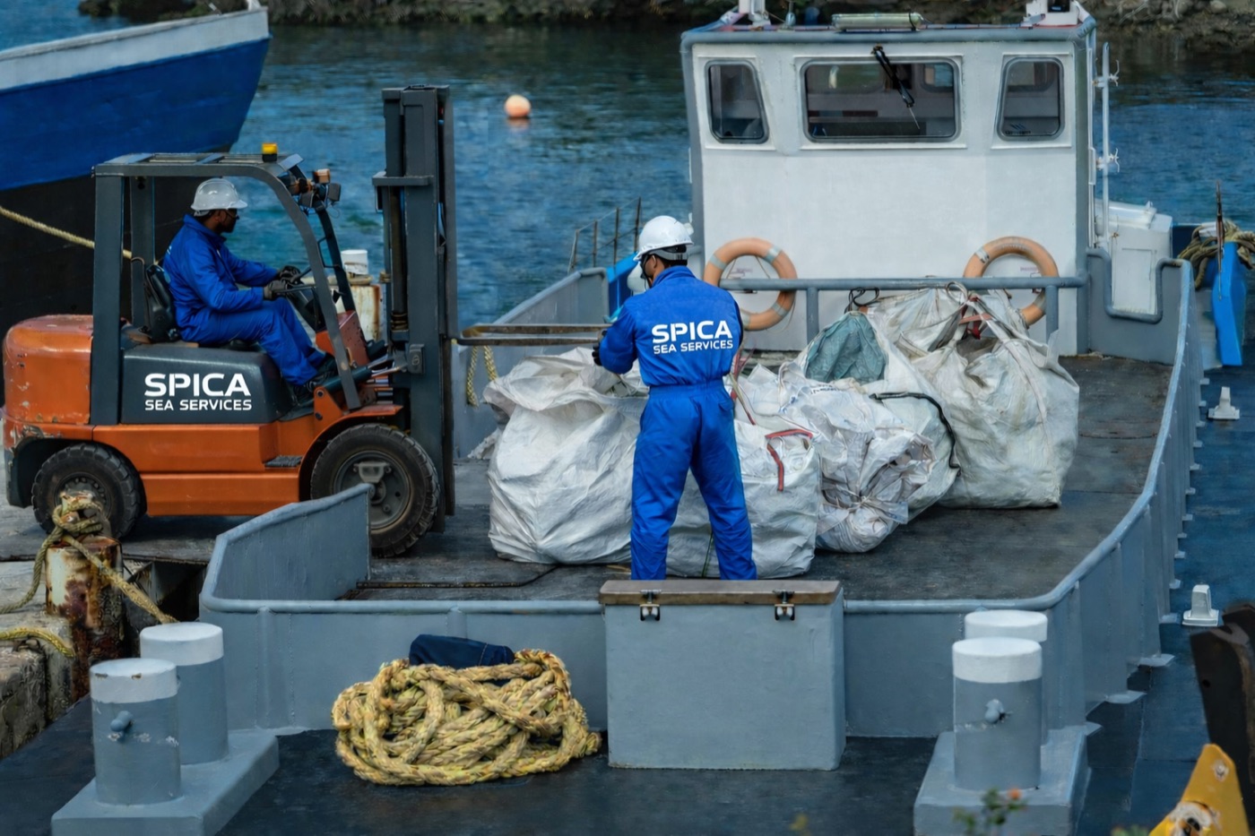 SPICA crew on a marine workboat handling waste removal and environmental services in the Port of Vancouver